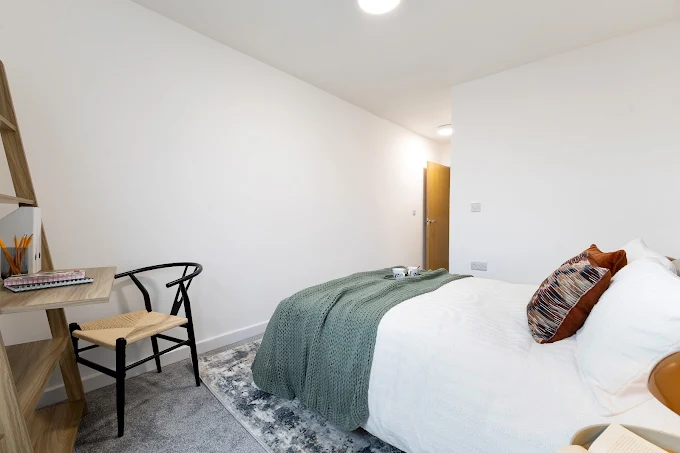 Furnished double bedroom with study desk at William Tarrant House