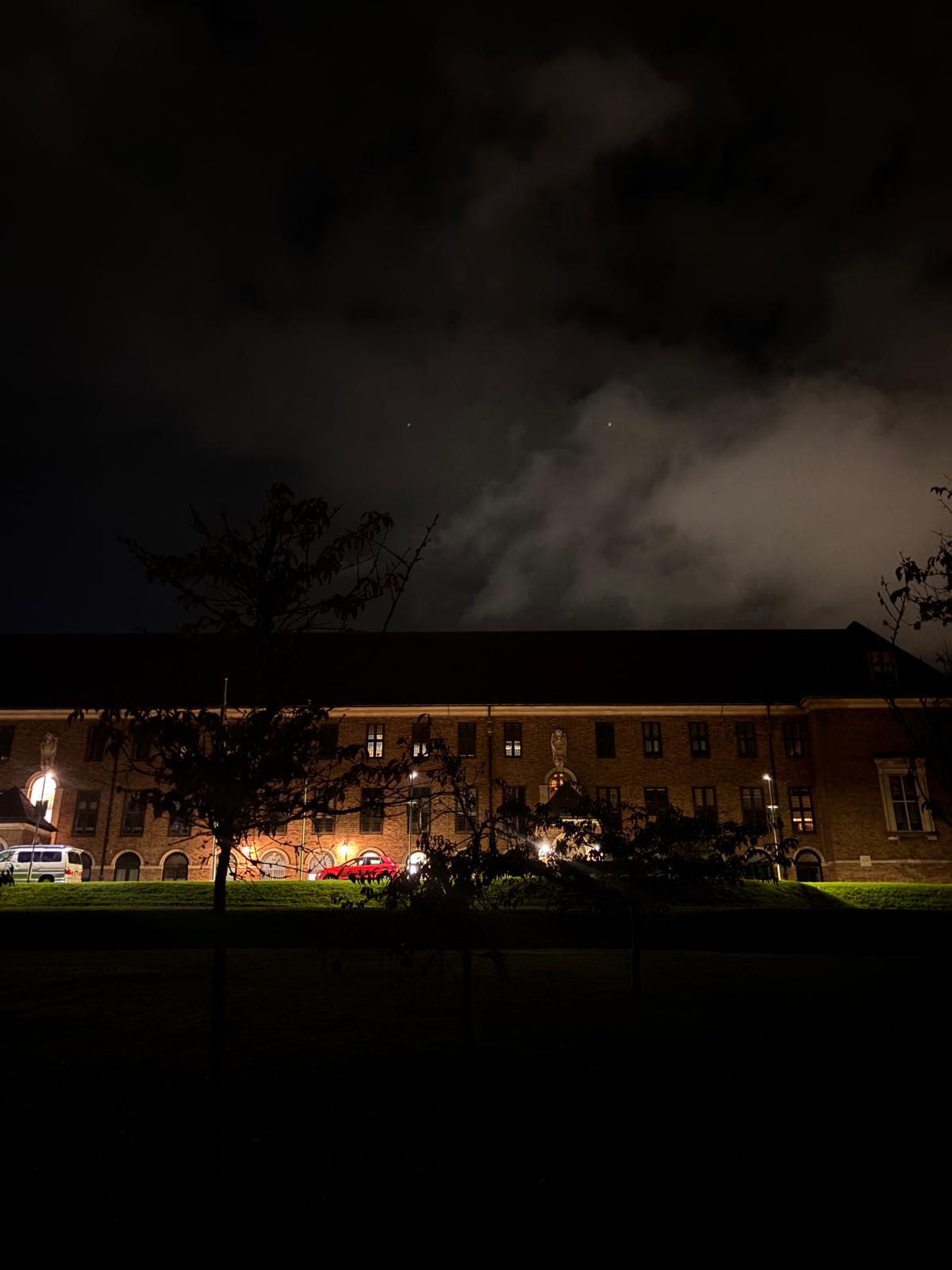 The building glowing warmly at night